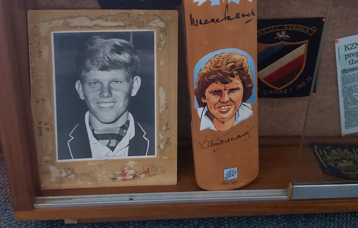 A photo of Barry Richards in his DHS honours’ blazer alongside a bat signed by Richards and Graeme Pollock.