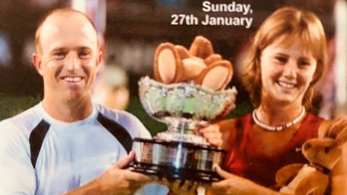 Kevin and Daniela Hantuchova lift the trophy after claiming the Australian Open mixed doubles title with a convincing 6-3, 6-2 win over the Argentinian pair of Paola Suarez and Gastón Etlis in the final.