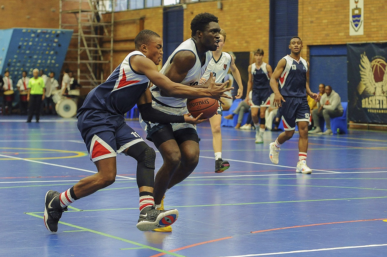 Michaelhouse point guard and co-vice-captain Banele Sithole attempts a steal in the final against Saint John’s. (Photo: https://www.stjohnscollege.co.za/basketball/)