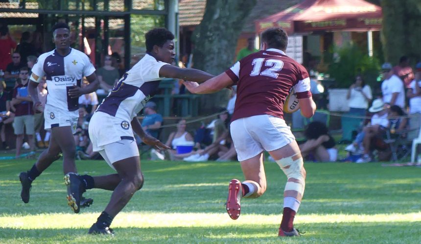 Kearsney centre Connor de Bruyn attempts to fight off a tackle from Northwood flyhalf Emmanuel Bhiya.