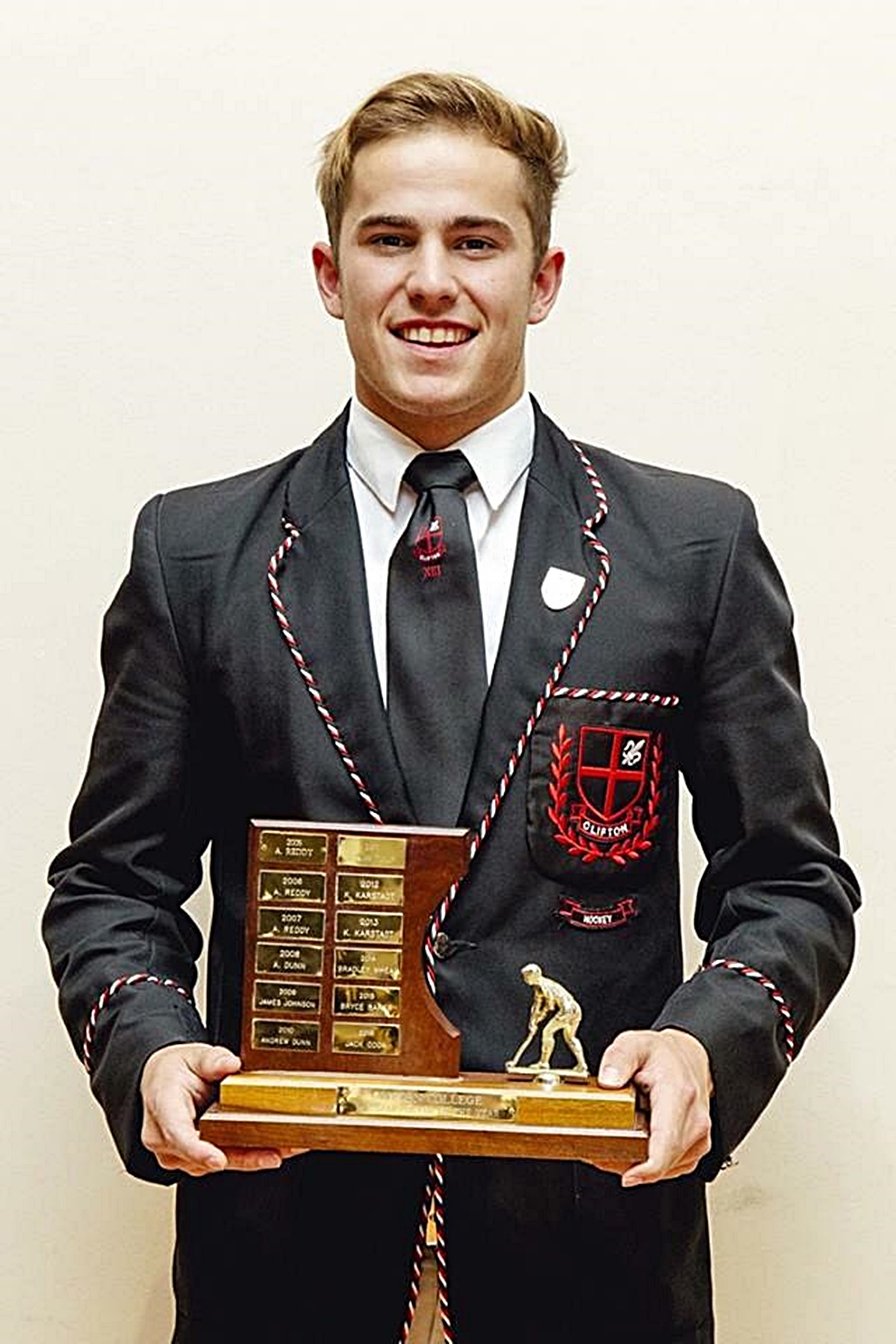 Matt Lewis shows off the trophy he received for being Clifton's Hockey Player of the Year in 2018.