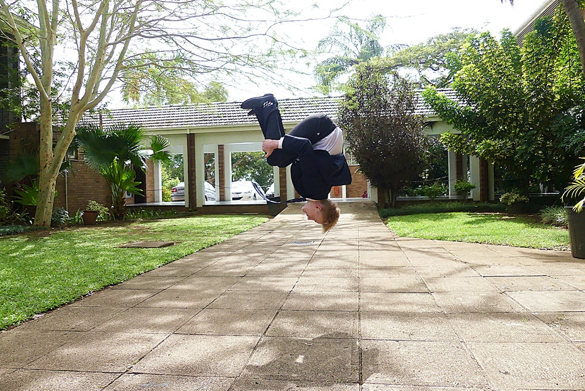 Full school uniform, standing back flip, no problem! (Photo: Brad Morgan)