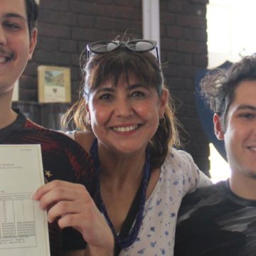 Daniel Kreuzer, his mother Razina, and brother Mikail, celebrate Daniel bagging nine distinctions in the 2022 matric final exams.