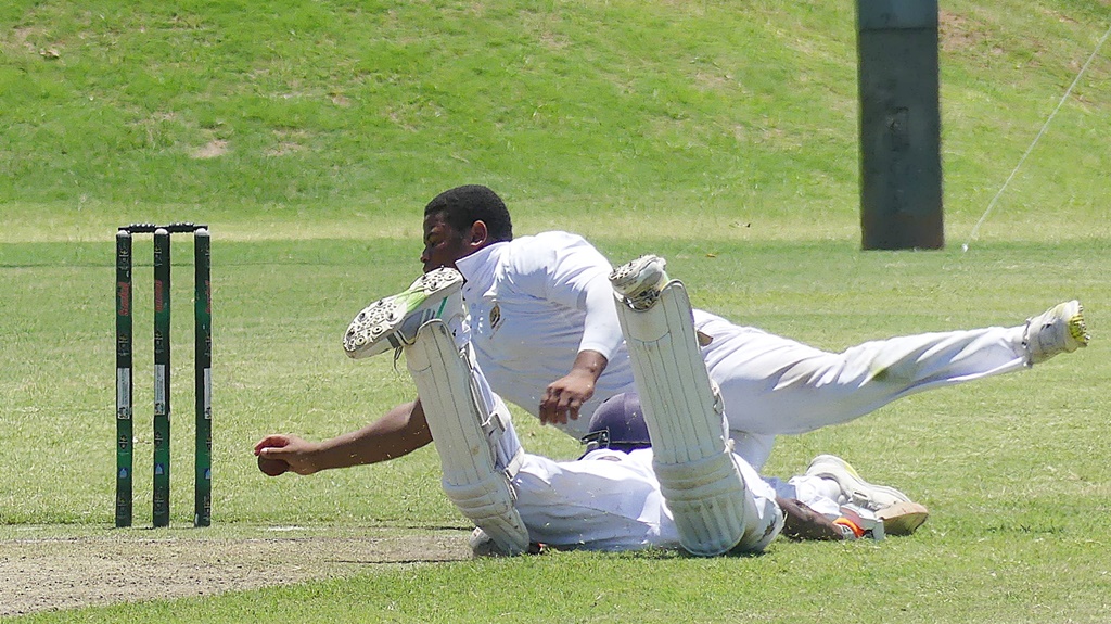 Saints' Matthew Urquhart attempts a run out in Northwood's innings (Photo: Brad Morgan)