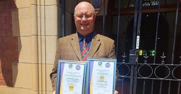 Morné Scott, Glenwood's Deputy Headmaster in charge of Academics, with certificates presented to the school by the Umlazi District for its strong results in the 2022 matric final exams.