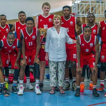 The Maritzburg College basketball 1st team with Jenni Orchard.