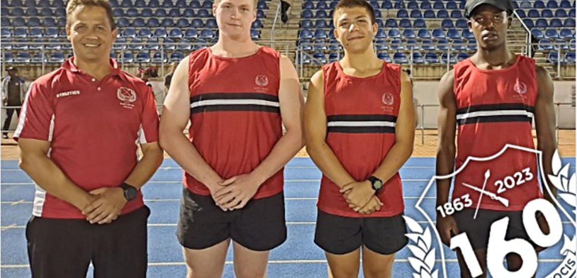 Master in charge of Athletics at Maritzburg College, Meiring Kritzinger, with Josh Sweetnam, Theo Boshoff and Yethaba Mchunu.