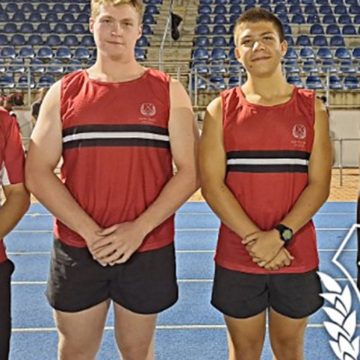 Master in charge of Athletics at Maritzburg College, Meiring Kritzinger, with Josh Sweetnam, Theo Boshoff and Yethaba Mchunu.