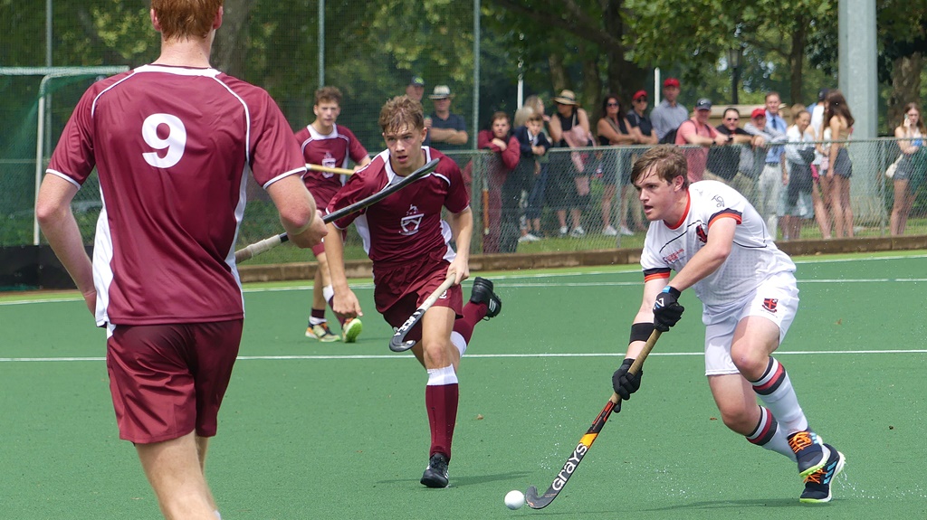 Clifton's Kyle Thomas carries the ball through the midfield as Kearsney captain Dylan Wiggett (9) moves to intercept his run. (Photo: Brad Morgan)