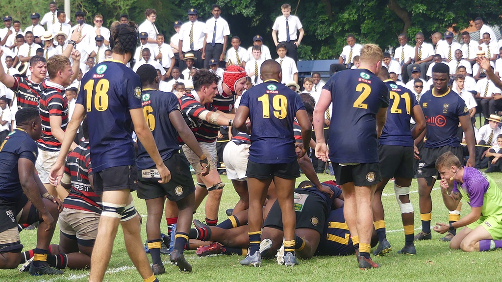 Down on his knees, the referee signalled that DHS had denied Maritzburg College a try for the second time in the contest after College had made it over the DHS try-line. (Photo: Brad Morgan)