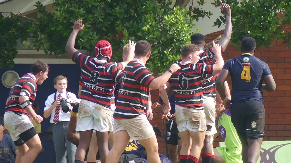 Arms raised, Maritzburg College players celebrate Phiwayinkosi Kubheka's try. (Photo: Brad Morgan)