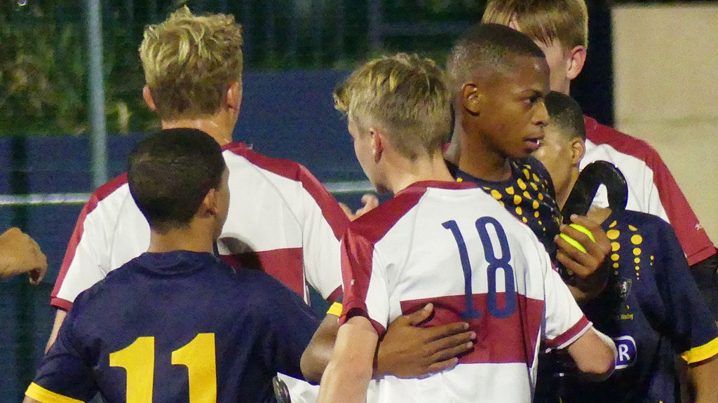 After the game, respect for the opponent's efforts. (Photo: Brad Morgan)