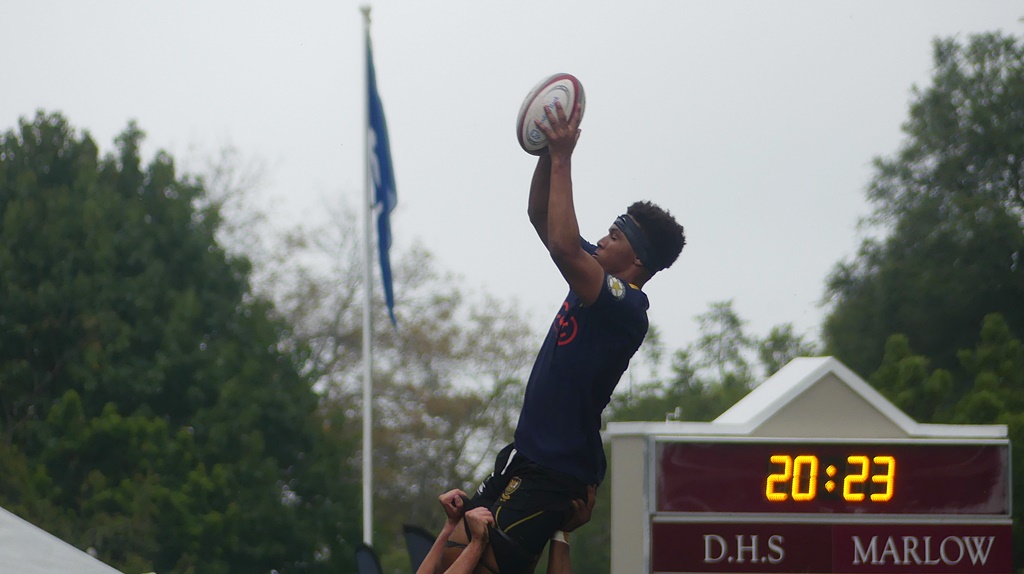 Eighth-man Dale Hendrikse rises high in the gloomy, grey conditions to snare a lineout ball for DHS. (Photo: Brad Morgan)