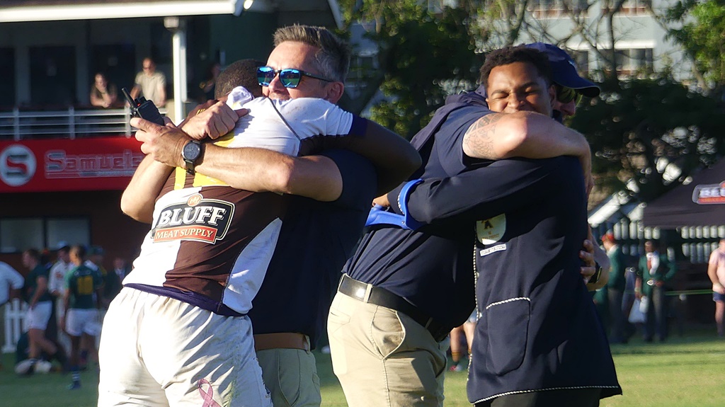 Knights' coach Jeremy McLaren doled out plenty of hugs after his team upset Glenwood. It was an emotional victory. (Photo: Brad Morgan)