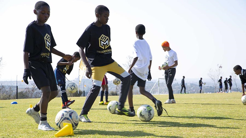 Youth at a Santuako Movement Football Clinic conduct an exercise. (Photo: https://illummination.com/)