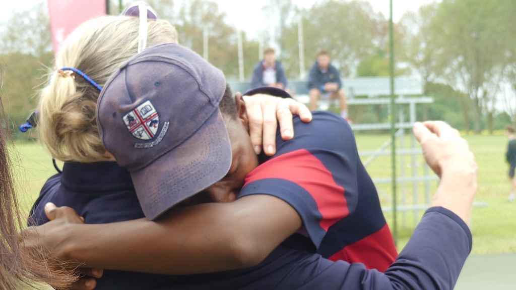 An emotional Lindo Gcwensa received a hug from Westville Director of Sport, Pam Hayward, after his win clinched the Spar Kearsney Tennis Festival for the school. (Photo: Brad Morgan)