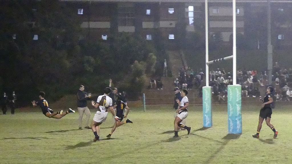 DHS flyhalf Deano Boesak finishes a fine solo try-scoring effort with a flourish. (Photo: Brad Morgan) 