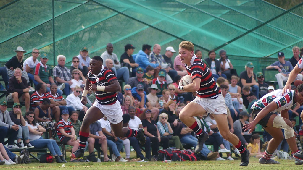 Rhett Quinn, with Luyanda Kunene on his outside, launches an attack against Pretoria Boys' High. (Photo: Brad Morgan)