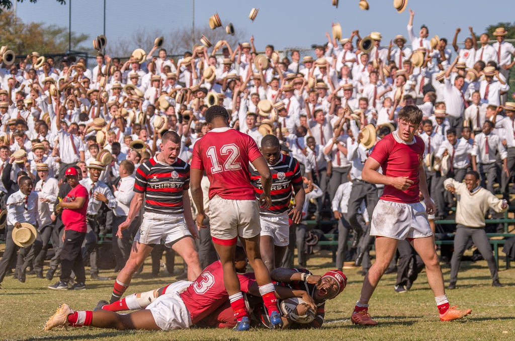 Captain Sasha Kadira crashes over for a try, with Colm Reardon (left) and Luyanda Kunene (right) celebrating the score, too. In the background, Basher Ridge explodes with joy. (Photo: Photo: Justin Waldman Sports Photography)