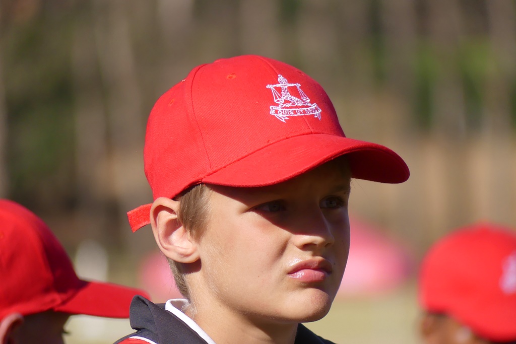 The red of the Michaelhouse Sevens caps added dashes of colour around the action taking place on the fields. (Photo: Brad Morgan)