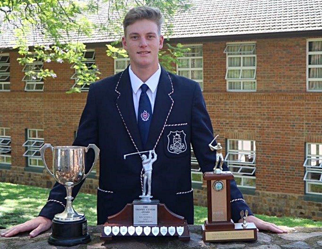 Julian Daws shows off the Durban and Districts A League trophy, the the KZN Schools Team Championship trophy and the SA Schools Trophy - all won in the 2022 season.