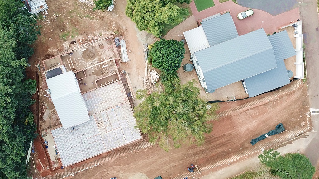 An aerial view of Huberta House, on the right, which will share styling cues with the new BE, on the left.