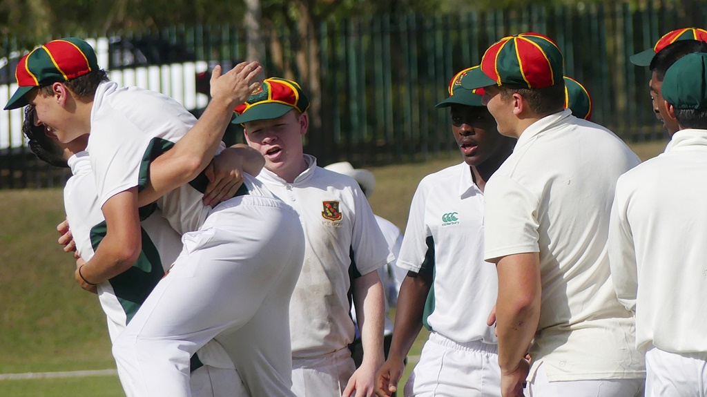 It's hugs all round for Glenwood's Slade Lock (second from left) after he pulled off a stunning catch against Cornwall Hill College. (Photo: Brad Morgan)