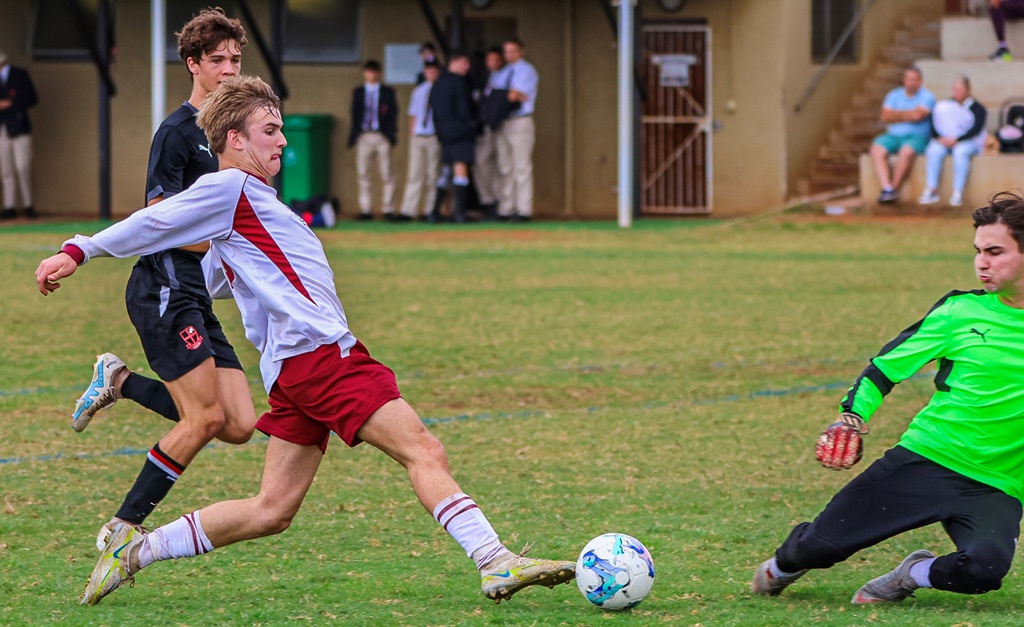 Kearsney's Chad Croshaw attempts to stab the ball into the Clifton goal. (Photo: Hannah Shirley)