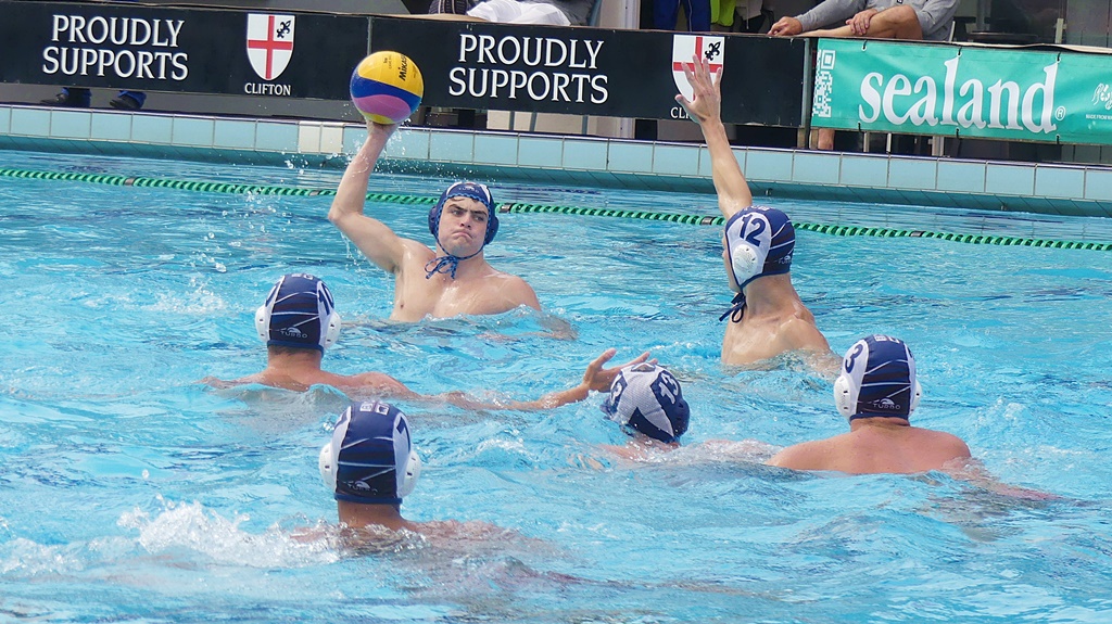 Westville (white caps) put up a wall between Saint Andrew's College and their goal, which helped them record a shutout in the playoff for 7th and 8th places. (Photo: Brad Morgan)