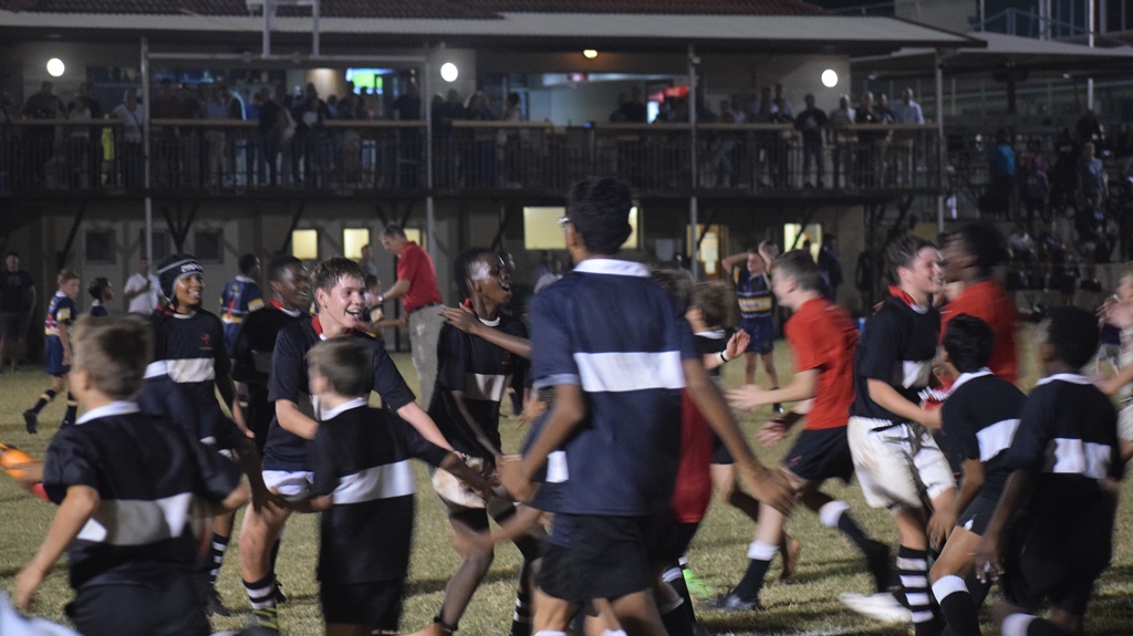 Clifton Prep's 1st XV is swamped by supporters after their stirring come-from-behind victory over DPHS.