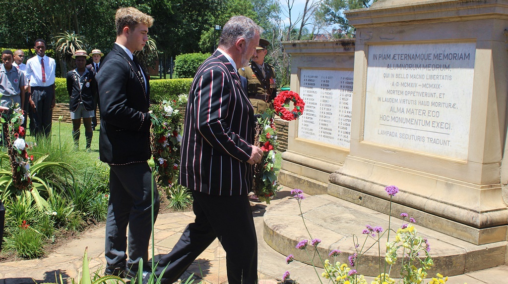 Maritzburg College's 2024 Head Prefect, Cody Robinson, and Headmaster, Doctor Chris Luman, lay down their wreathes.