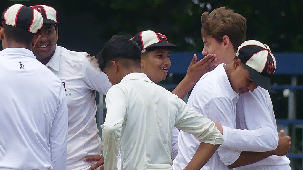 Clifton's bowlers enjoyed regular successes against the DHS batsmen, leading to some happy huddles. (Photo: Brad Morgan)