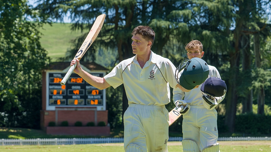 With his unbeaten 157 shining on the scoreboard, Hayden Bishop exits the Roy Gathorne Oval to deserved applause. (Photo: Justin Waldman Sports Photography)