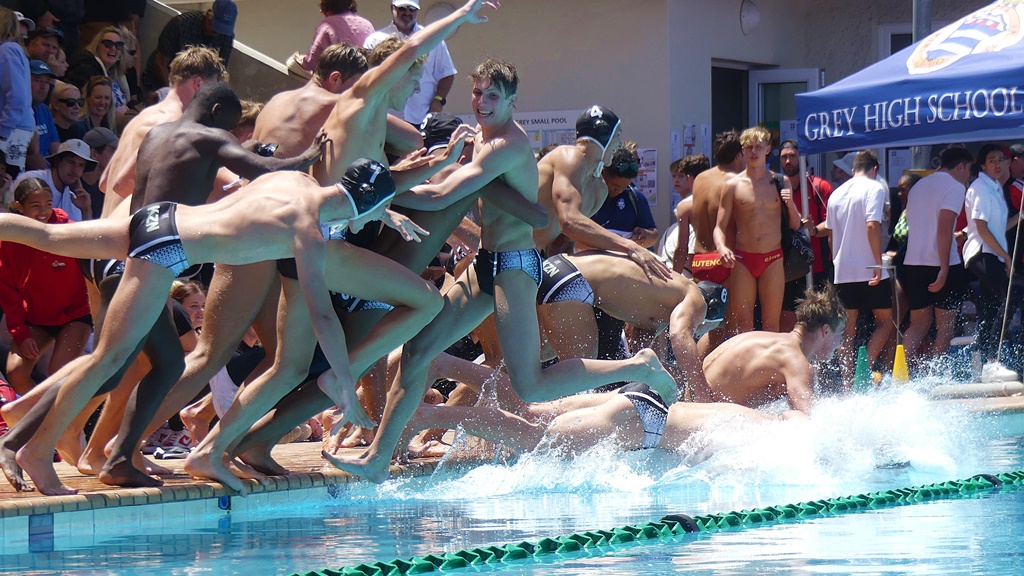 Winners! The KZN u16 team takes the champions' dive into the Grey High pool after securing the Inter-Provincial title. (Photo: Brad Morgan)