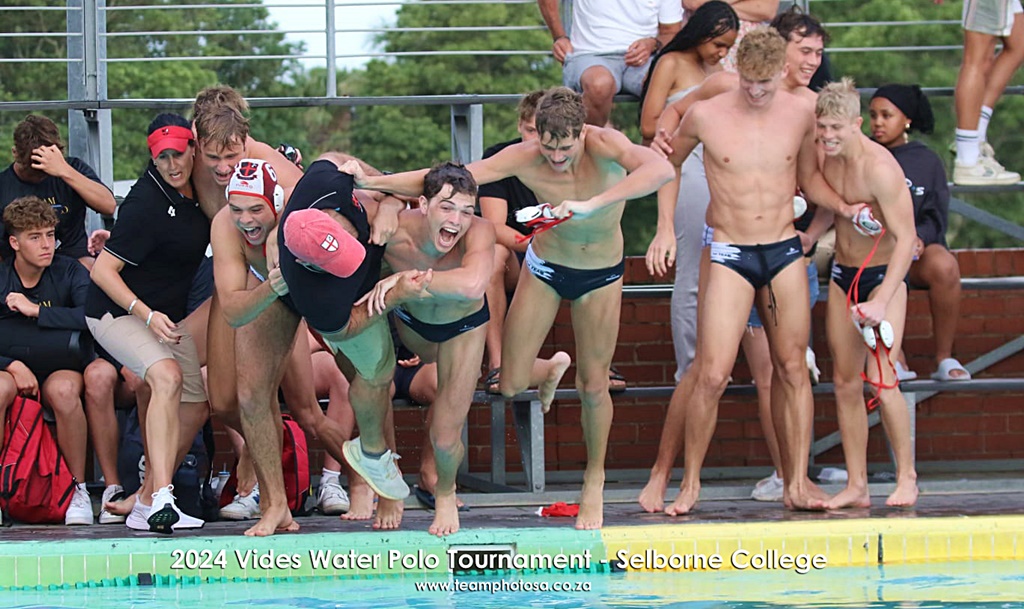 Clifton College coach Paul Martin happily joined his team in the pool when they took the traditional champion's swim. (Photo: TeamPhoto SA)