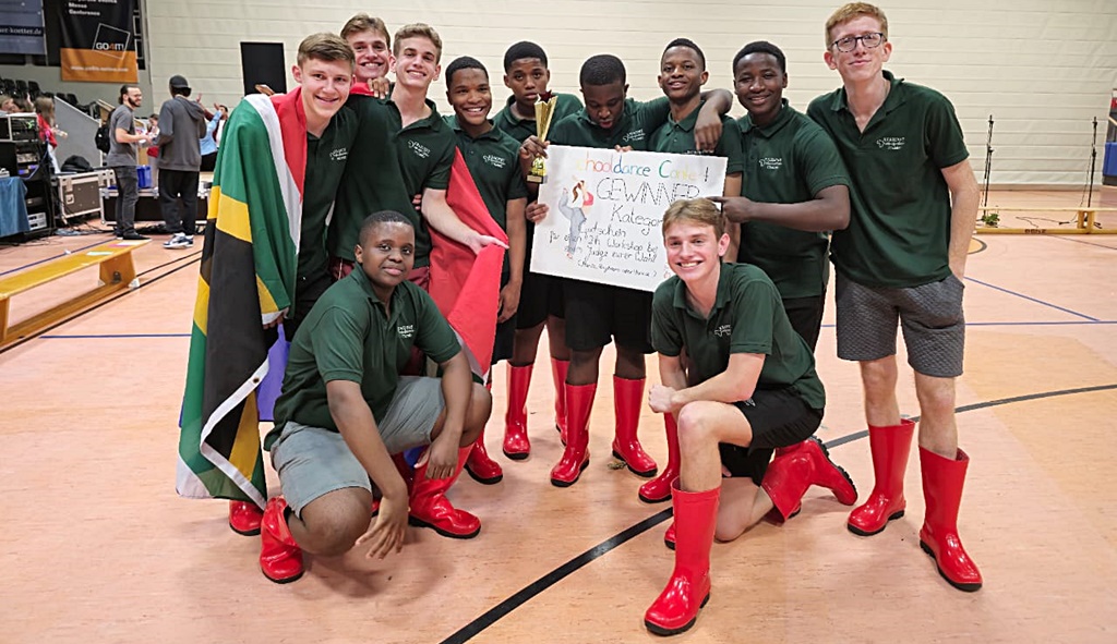 Kearsney Gumboot DancersFront, crouched: Mpande Luhlongwane, Finn Calenborne Back, left to right, from SA flag bearer: Daniel van Jaarsveld, Liam Calenborne, (peeping between Daniel and Nathan), Evan Powers (with flag), , Tito Mhlongo, Vuyo Mcanyana, Sethu Magubane (with trophy in hand/certificate), Mogau Tladi, Bupe Chiluba, Kristian Bunyan