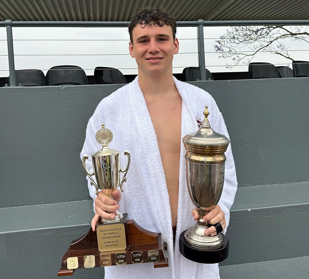 Blake Kruger, after an 8-7 defeat of Hilton College in his school record 176th 1st team match, holds the 1st team and overall trophies of the KZN Top 10 Water Polo Tournament. (Photo: Hannah Shirley)