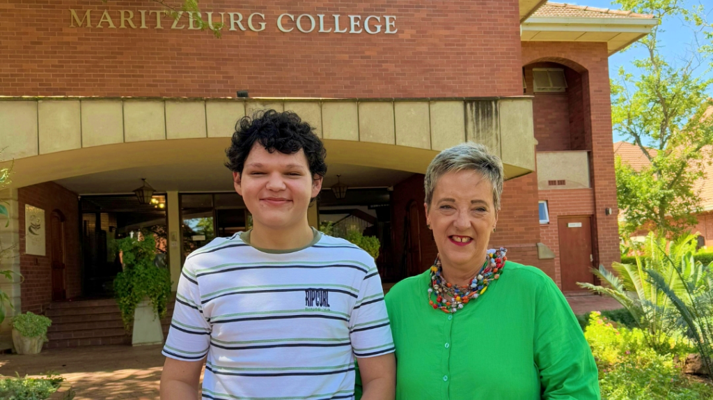 Jandre van Huyssteen, the recipient of seven distinctions, with Deputy Head of Academics, Jeanette Finnie.